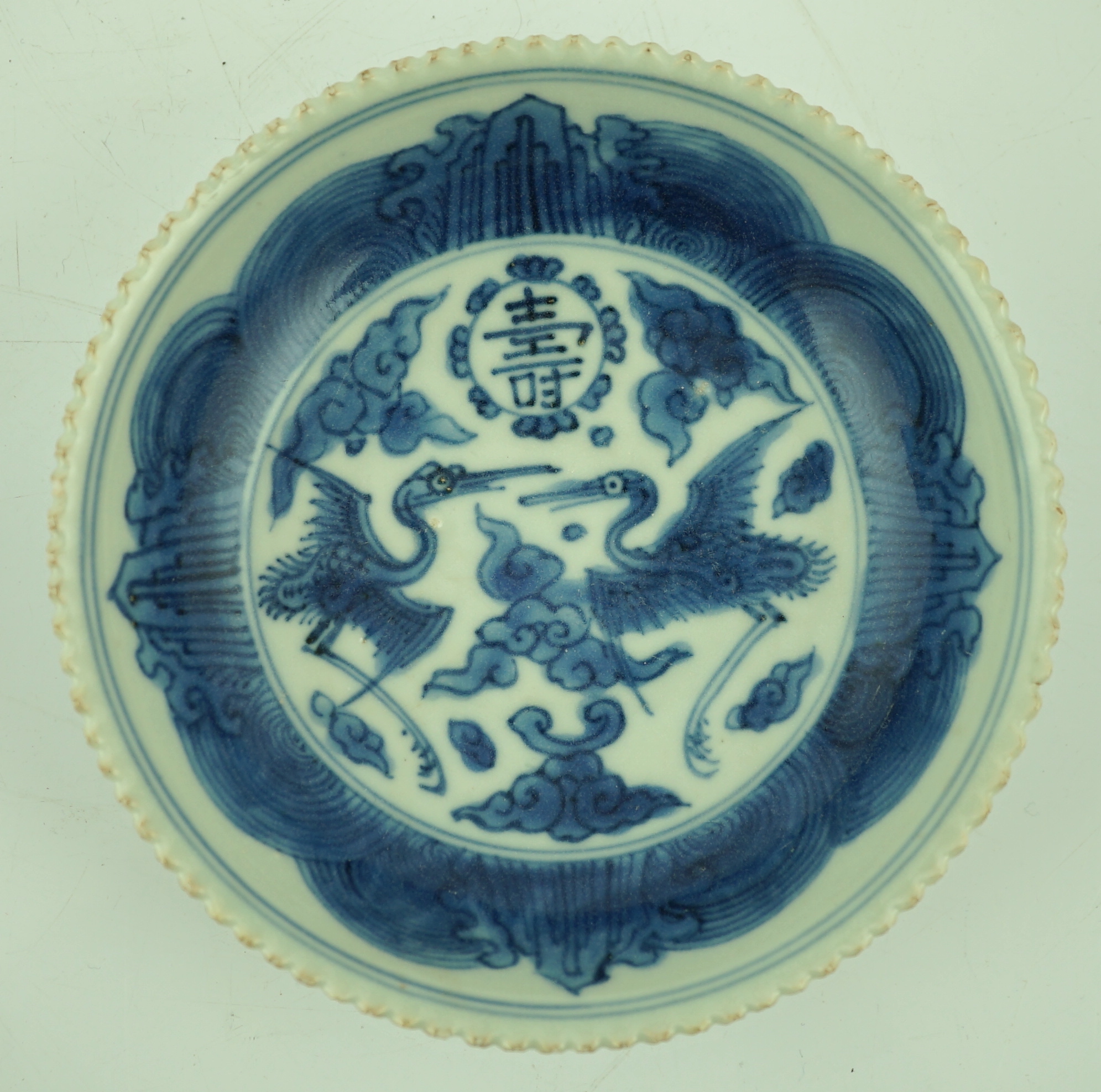 A Chinese blue and white ‘phoenix’ saucer dish, Jiajing mark and probably of the period
